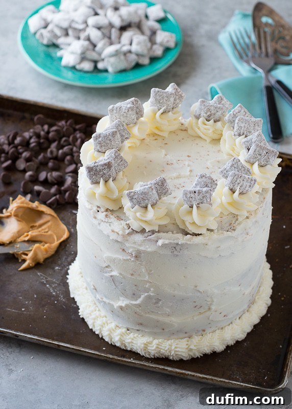 Three cake layers cooling on a rack, with a bowl of finished puppy chow in the background, ready for assembly.