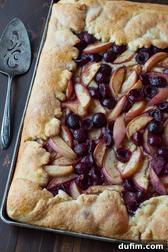 Cherry Peach Slab Pie - an easy open face pie made on a baking sheet! The crust is amazing!