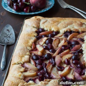 Cherry Peach Slab Pie - an easy open face pie made on a baking sheet! The crust is amazing!