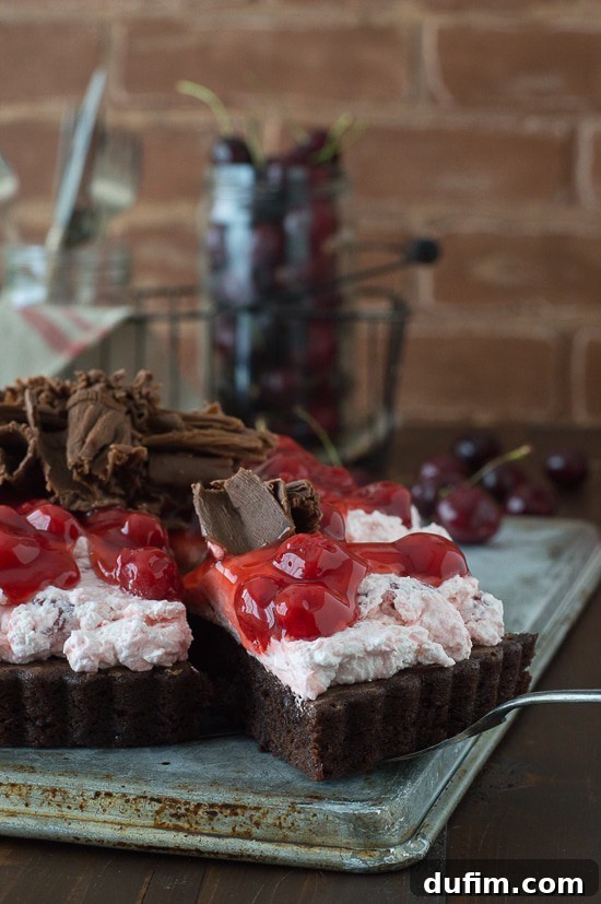 Cherry Brownie Tart - a brownie tart topped with cherry filling and chocolate curls!