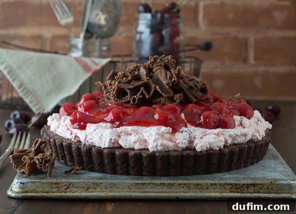 Cherry Brownie Tart - a brownie tart topped with cherry filling and chocolate curls!