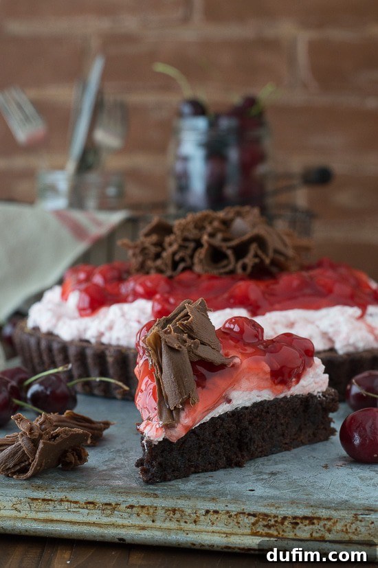 Cherry Brownie Tart - a brownie tart topped with cherry filling and chocolate curls!