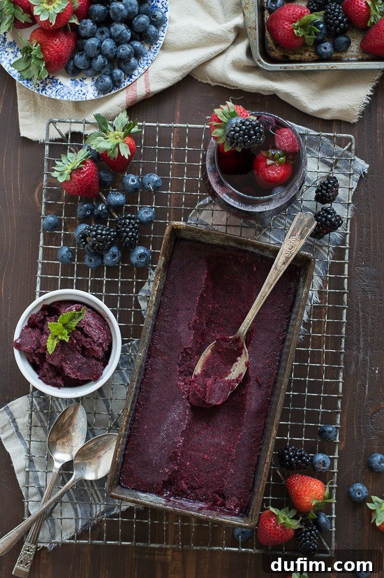 A vibrant bowl of homemade Berry Sangria Sorbet, perfectly scooped and ready to enjoy.