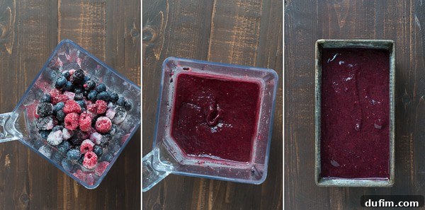 Close-up of a container filled with partially frozen berry sangria sorbet, showcasing its rich color and smooth texture.