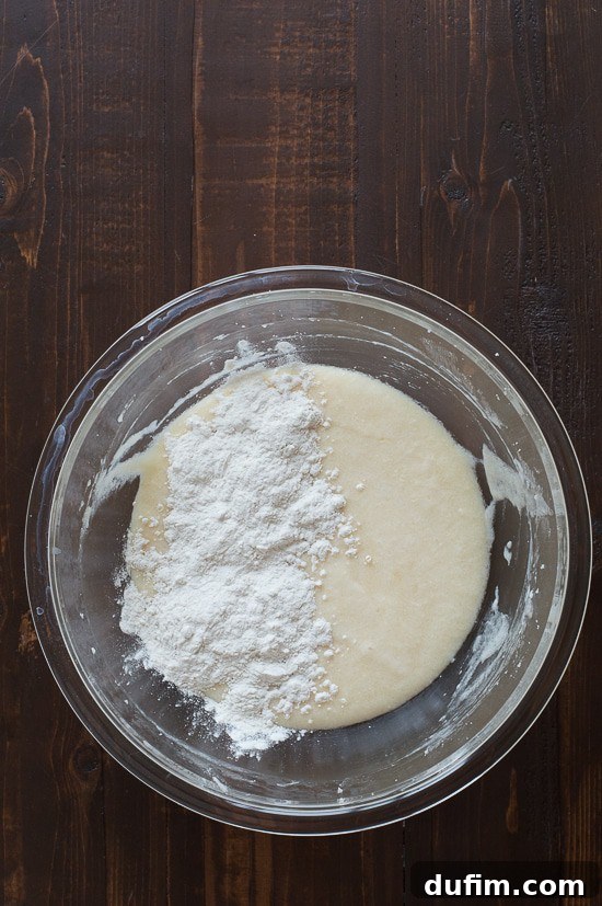 Adding dry ingredients to wet batter in batches