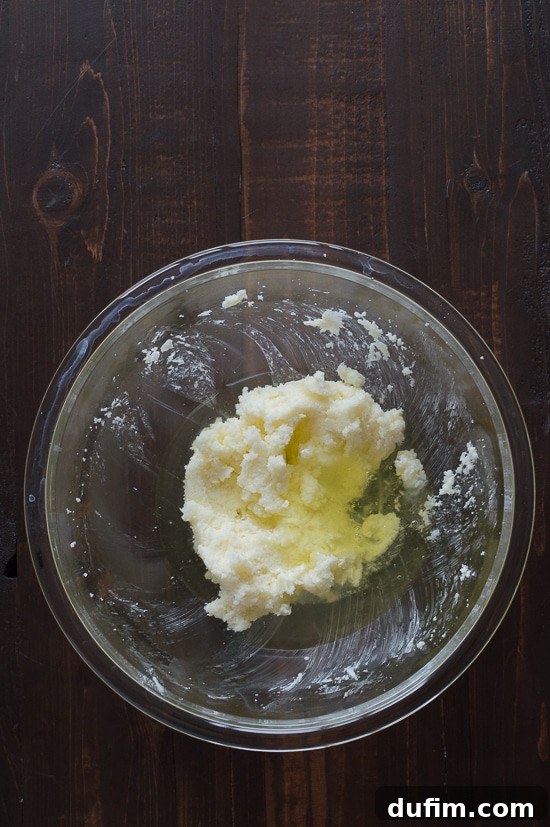 Adding eggs to cake batter