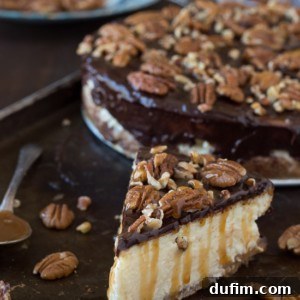 This is the best turtle cheesecake! It’s rich and so creamy. Topped with chocolate ganache, pecans and caramel sauce.