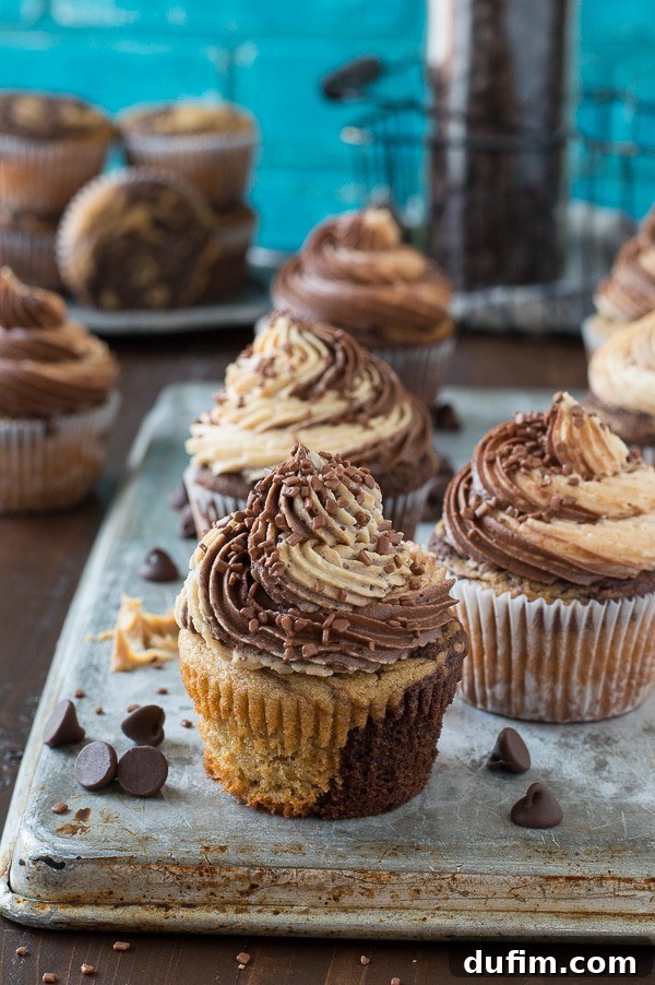 Chocolate Peanut Butter Bliss Cupcakes 5 Overhead view of several swirled chocolate peanut butter cupcakes, beautifully frosted and ready to enjoy.