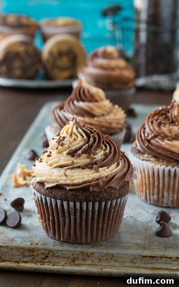Chocolate Peanut Butter Bliss Cupcakes 6 A stunning close-up of a swirled chocolate peanut butter cupcake, showcasing the intricate frosting design and delightful flavor combination.