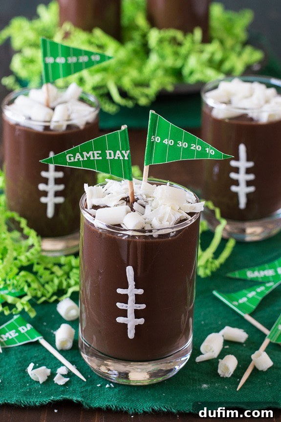 These football pudding cups are so cute for game day! Jazz them up with some white football stitches, chocolate curls, and a mini pennant!