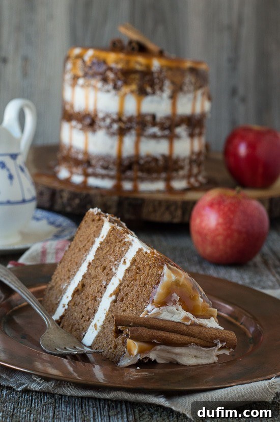 Harvest Apple Spice Cake with Golden Caramel Drizzle 5 Overhead view of the Apple Spice Cake, showcasing its delightful caramel drips and decorative cinnamon sticks, ready to be served.