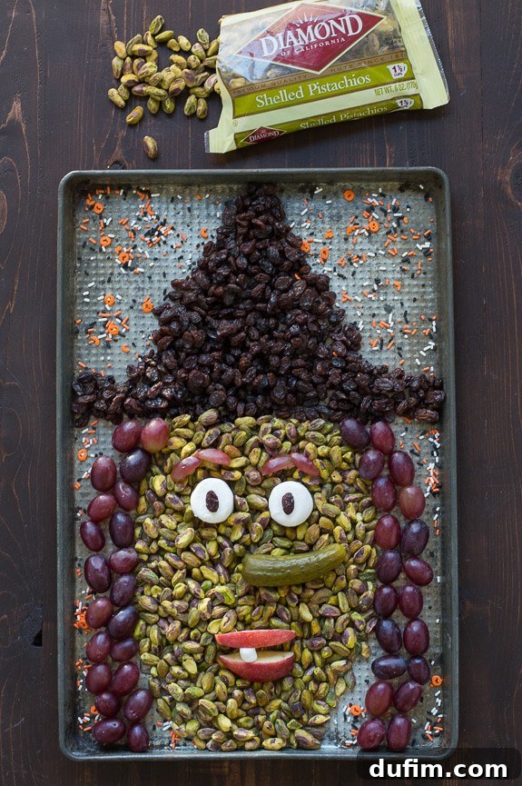 The finished Halloween Witch Platter, showcasing the detailed and edible art, ready to be served at a festive gathering.