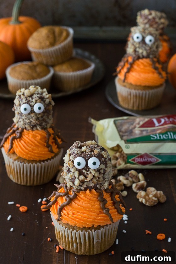 Close-up of a Pumpkin Walnut Spider Cupcake with candy eyes, perfect for Halloween.