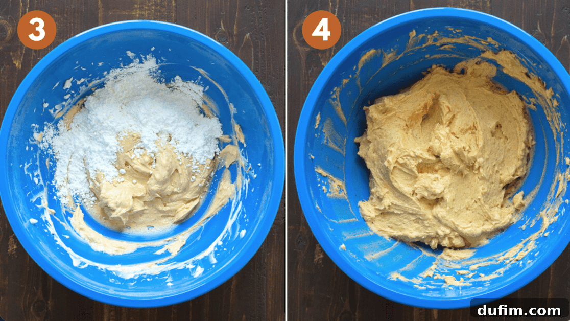 mixing pumpkin frosting in blue mixing bowl