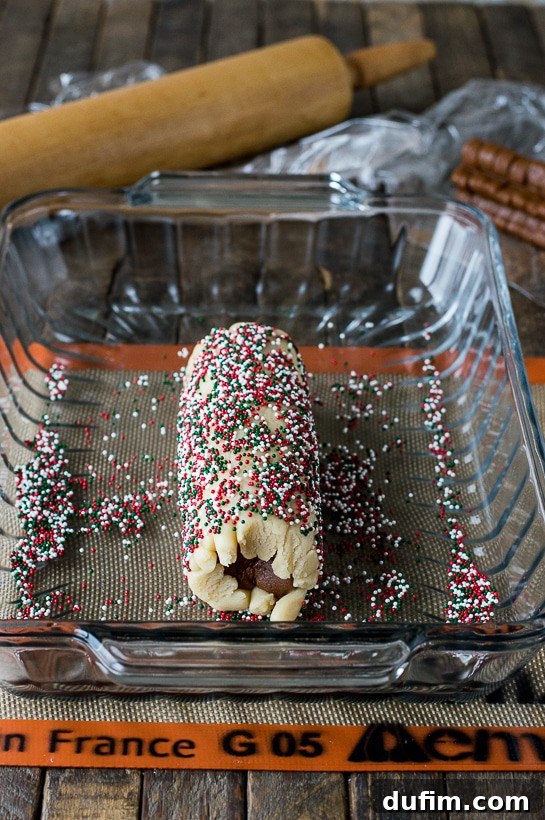 Gingerbread Spice Ready-Slice Cookies 13 Rolling the gingerbread cookie dough log in colorful nonpareil sprinkles for a festive finish.