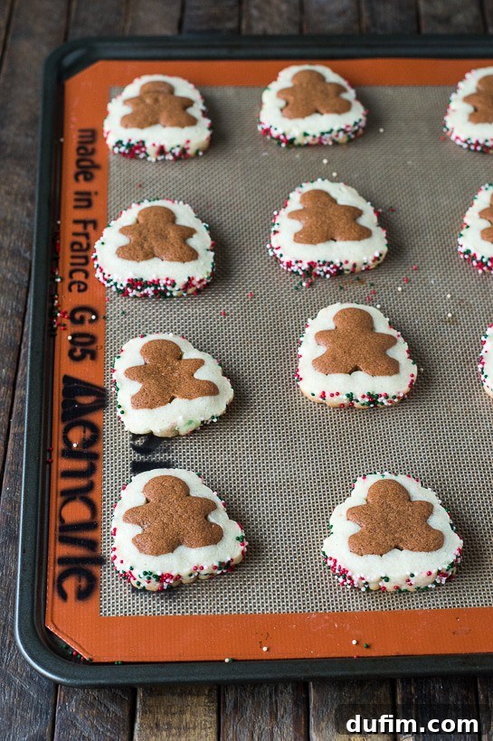 Gingerbread Spice Ready-Slice Cookies 5 Festive Homemade Gingerbread Men Slice N’ Bake Cookies, decorated with colorful nonpareil sprinkles.