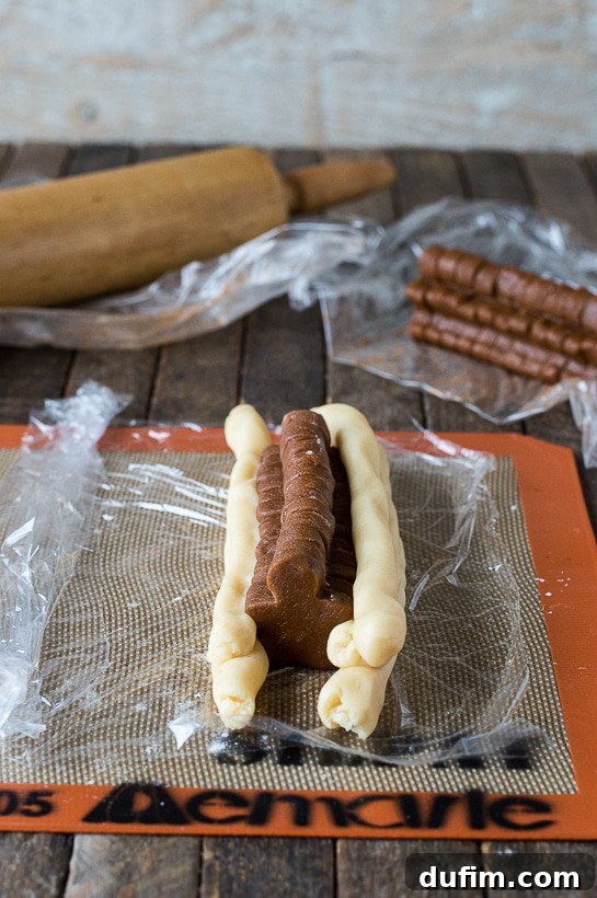 Gingerbread Spice Ready-Slice Cookies 10 Assembling the gingerbread men cookie log by wrapping with dough ropes.