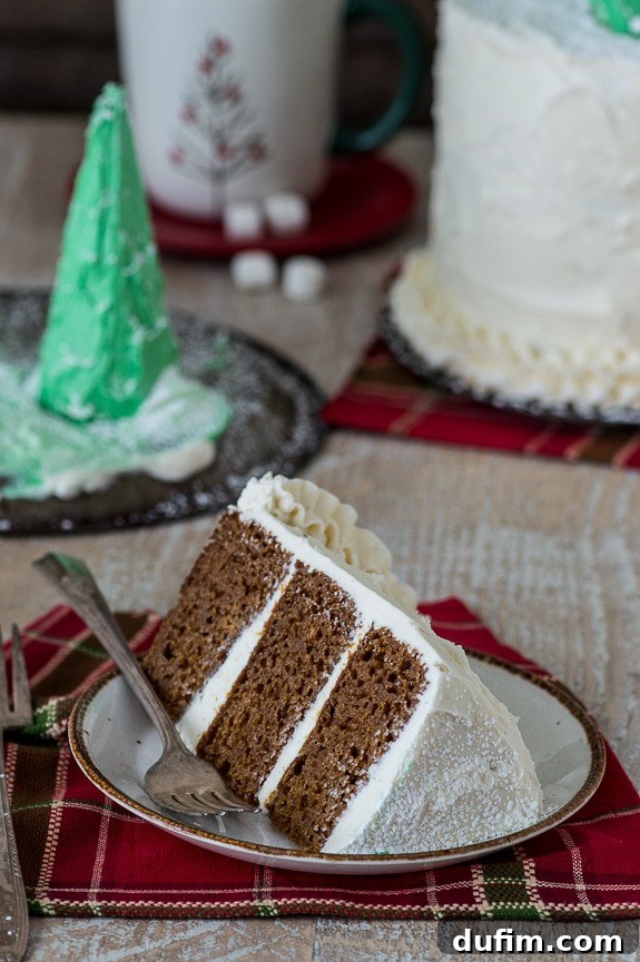 Side view of the gingerbread cake showcasing its three moist layers and thick buttercream