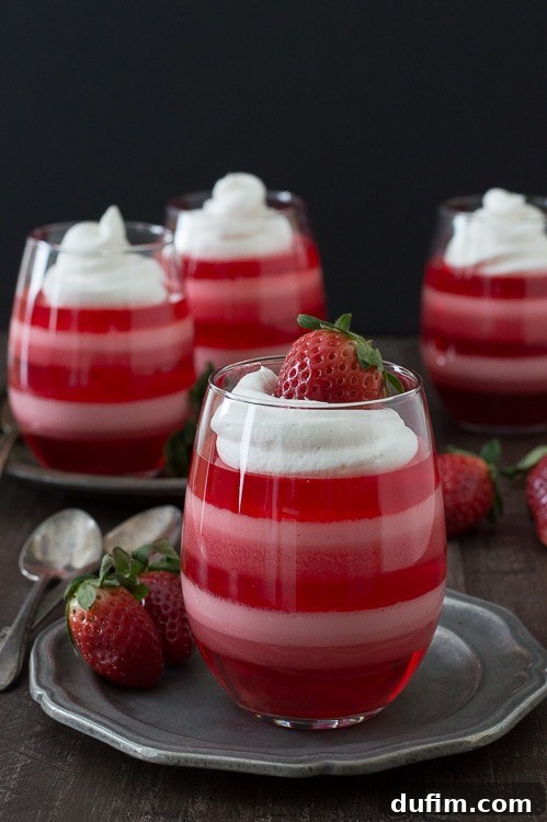The Flavors That Defined 2015 12 Refreshing Layered Strawberry Jello Cups with white and pink layers