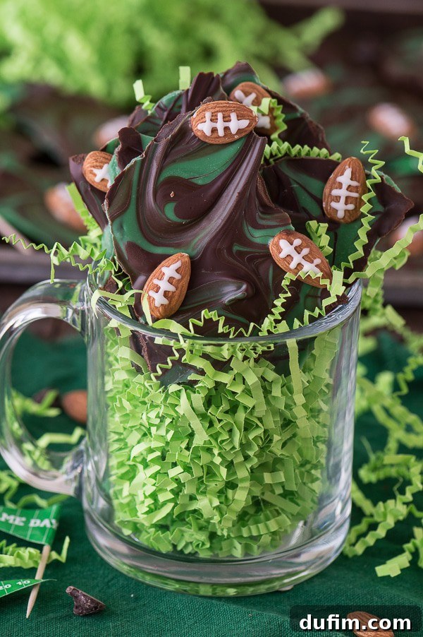 Close-up of Football Bark with intricately designed almond footballs, showcasing the two-tone chocolate.