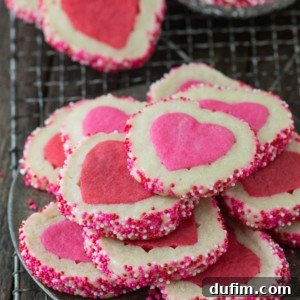 A stack of pink and white Homemade Valentine’s Day Slice N’ Bake Cookies on a cooling rack.
