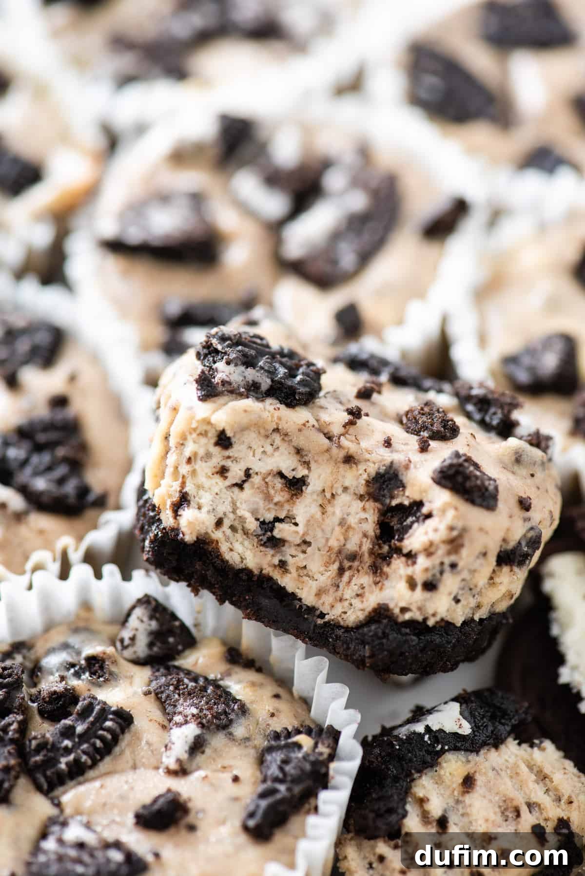 oreo cheesecakes arranged close together on white background
