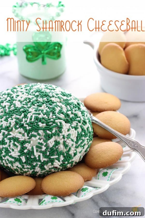 A festive Minty Shamrock Cheese Ball served with vanilla wafers in a charming St. Patrick's Day themed bowl.