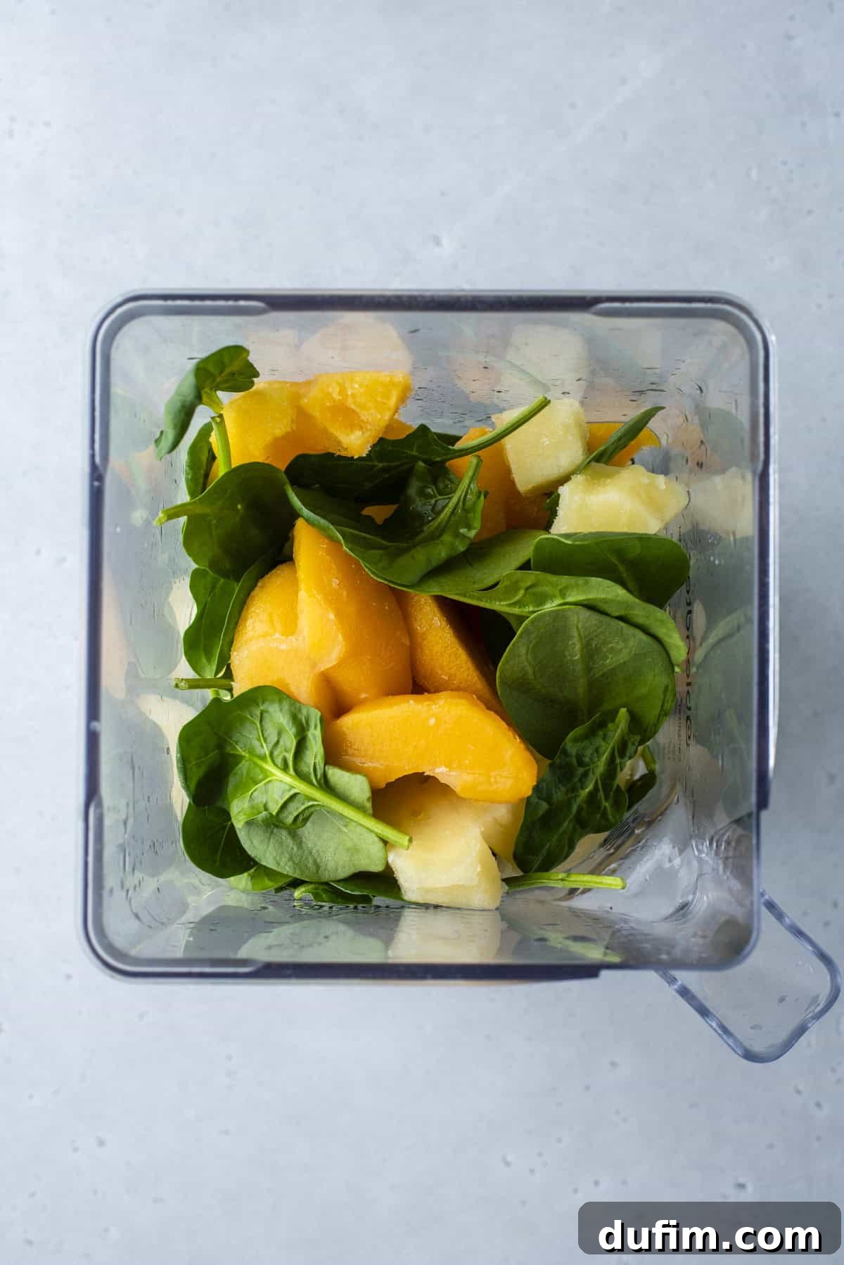 Colorburst Smoothie Delight 11 Fresh spinach leaves and frozen pineapple are blended for the green layer, a hidden boost of veggies.