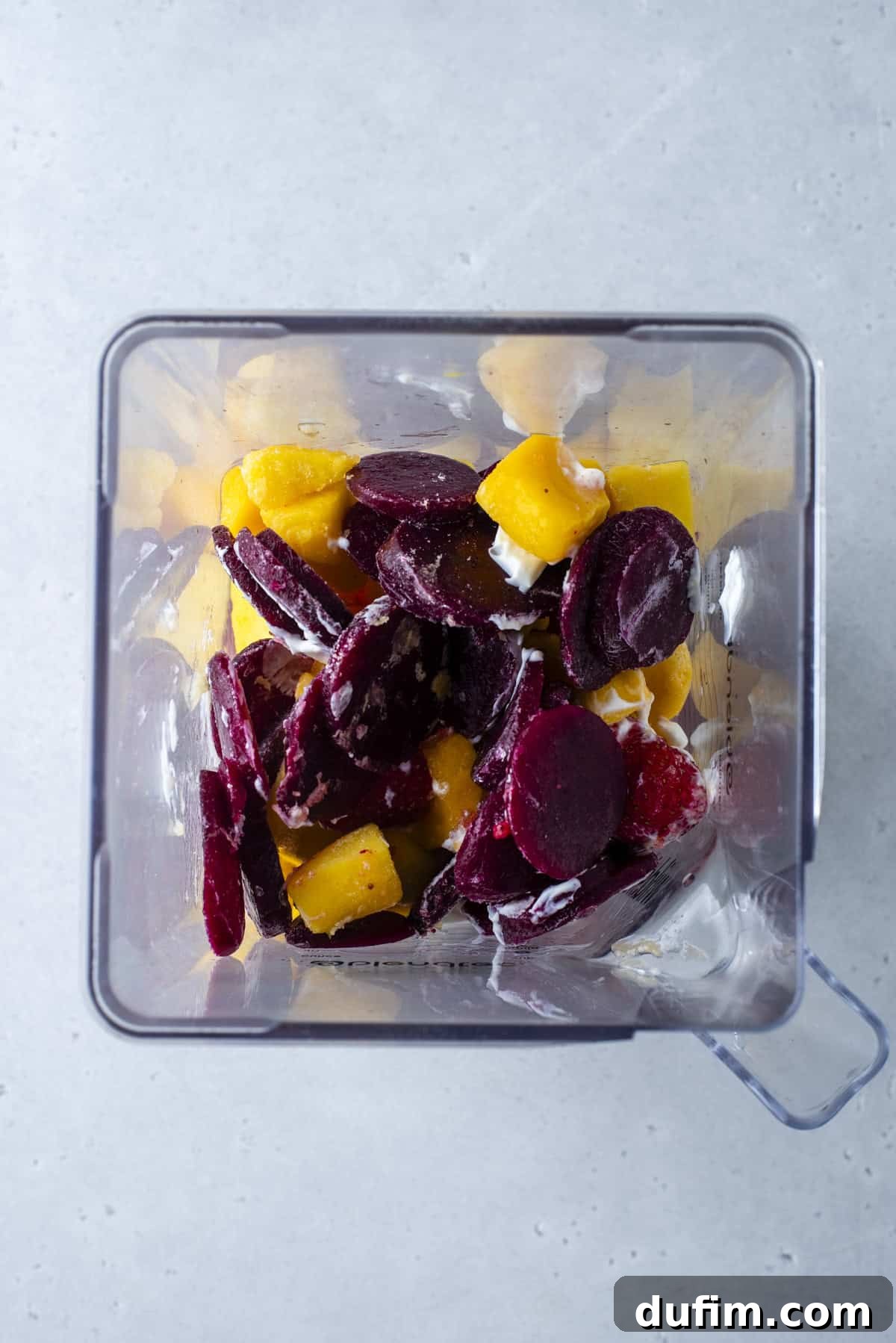 Colorburst Smoothie Delight 17 Frozen sliced beets are blended with fruit to create a striking magenta layer, offering an earthy sweetness.