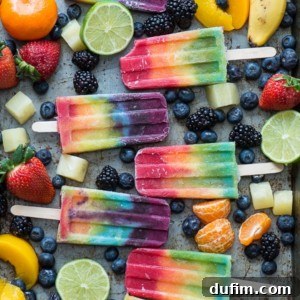 Outstanding 7 layer rainbow popsicles! Make your own homemade rainbow popsicles with lots of fresh fruit!