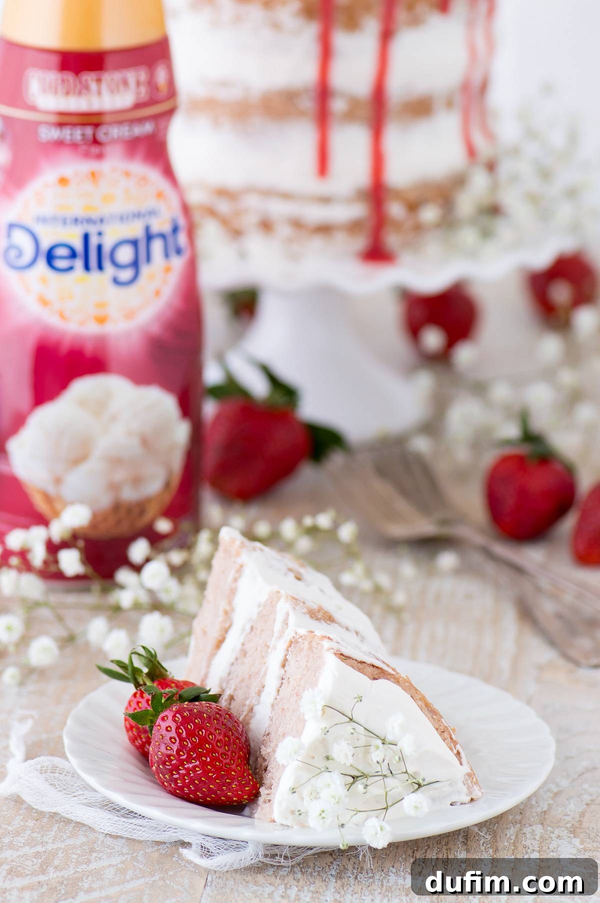 This strawberry naked cake is made with fresh pureed strawberries and is paired with homemade sweet cream whipped cream! Like a strawberries and cream cake!