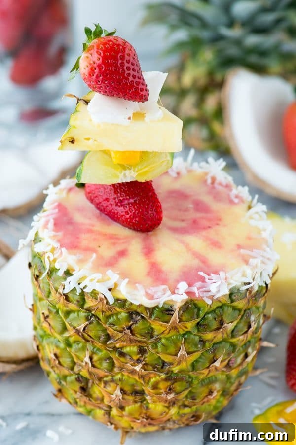Preparing to carve a fresh pineapple for a smoothie cup
