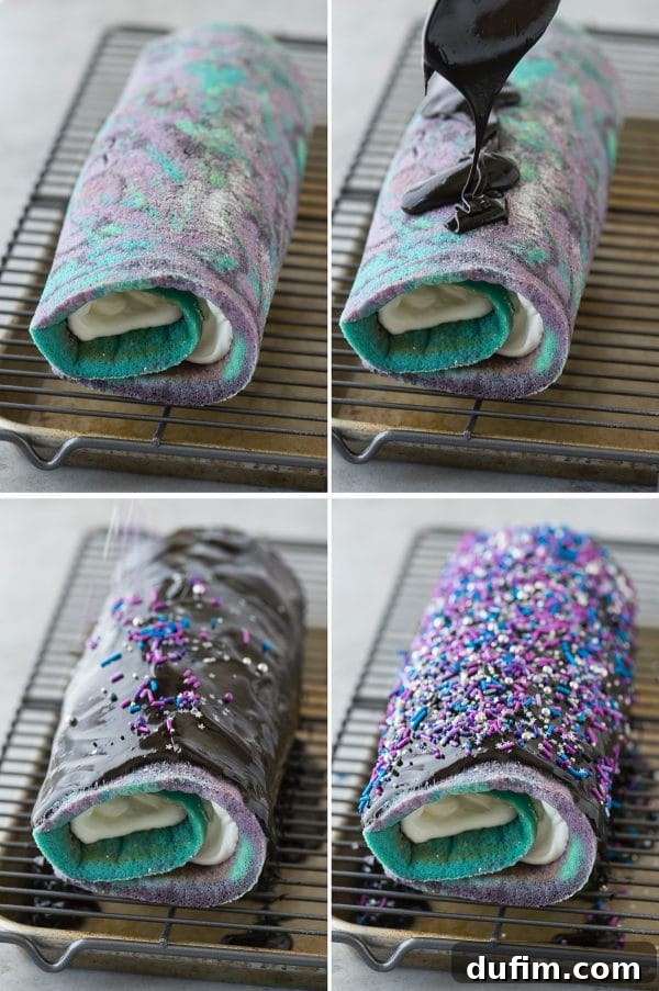 The fully assembled galaxy cake roll, coated in glossy black chocolate ganache and lavishly decorated with colorful sprinkles, sitting on a wire rack.