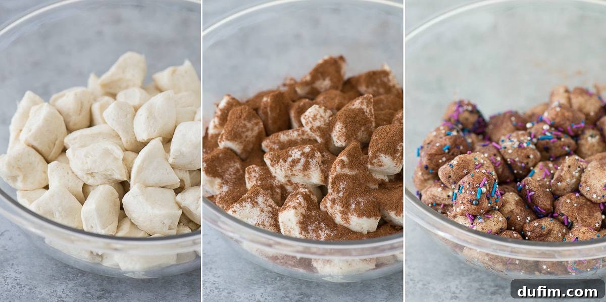 Biscuit dough pieces being tossed with sugar, cinnamon, and galaxy sprinkles in a bowl, showing the vibrant mixture.