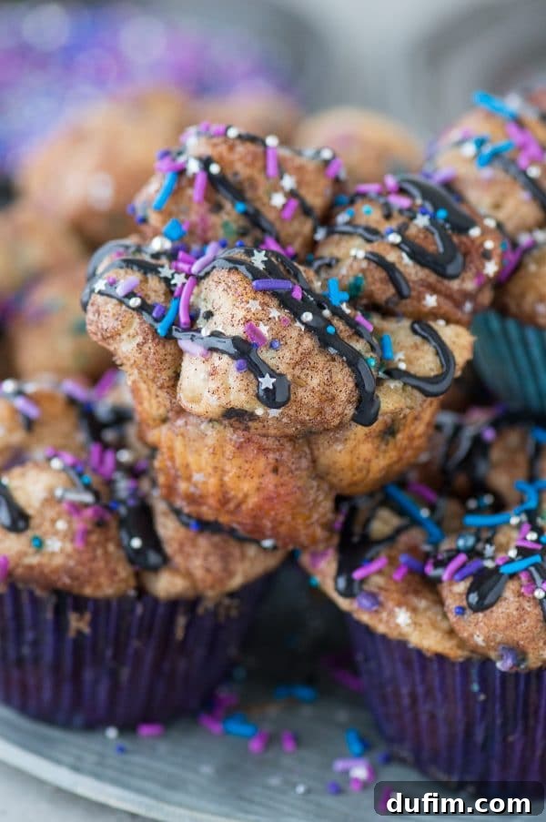 Close-up of dough pieces perfectly coated with cinnamon, sugar, and colorful galaxy sprinkles, ready for baking.