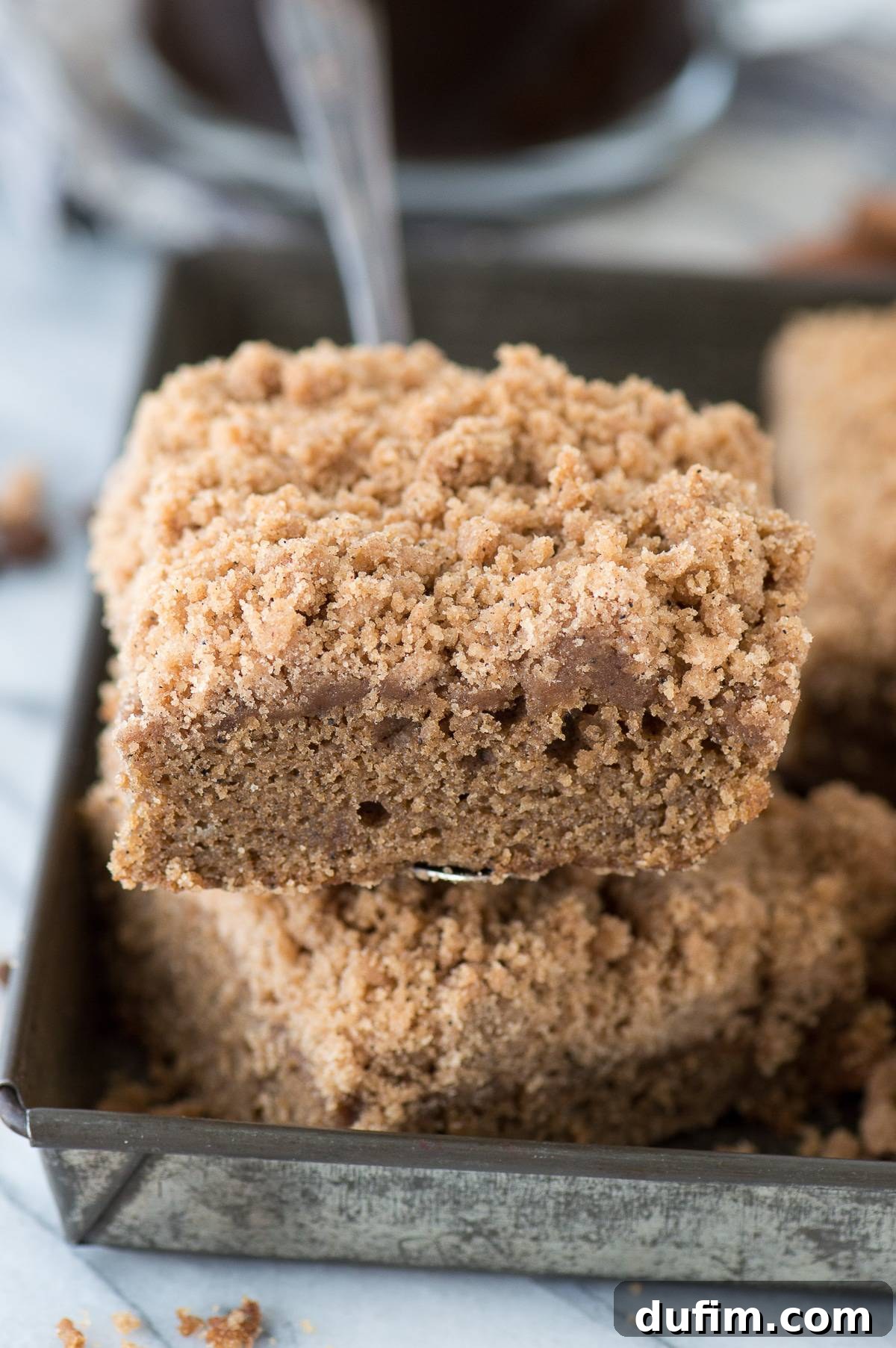 Close-up of a slice of Espresso Coffee Cake with a mile-high crumb topping, showing the rich coffee-infused cake and generous streusel.