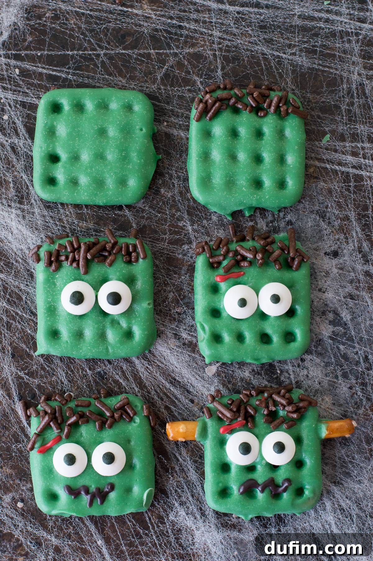 A step-by-step visual guide showing how to create Frankenstein treats from square waffle pretzels dipped in green chocolate with decorative embellishments, presented on a dark background.