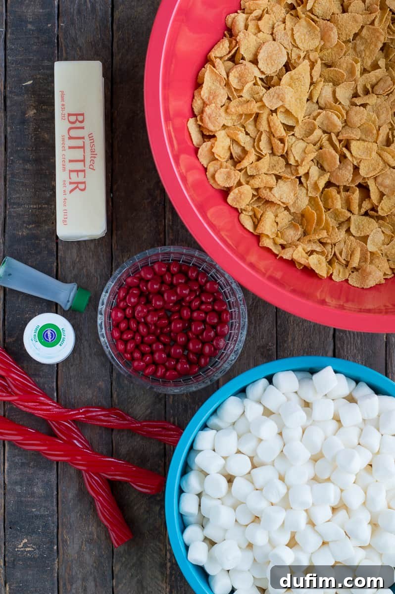 Golden No-Bake Wonders 4 A vibrant flat lay image showcasing all the simple ingredients required to make delicious Cornflake Wreaths, including butter, marshmallows, cornflakes, and red candies, neatly arranged on a rustic wooden background.