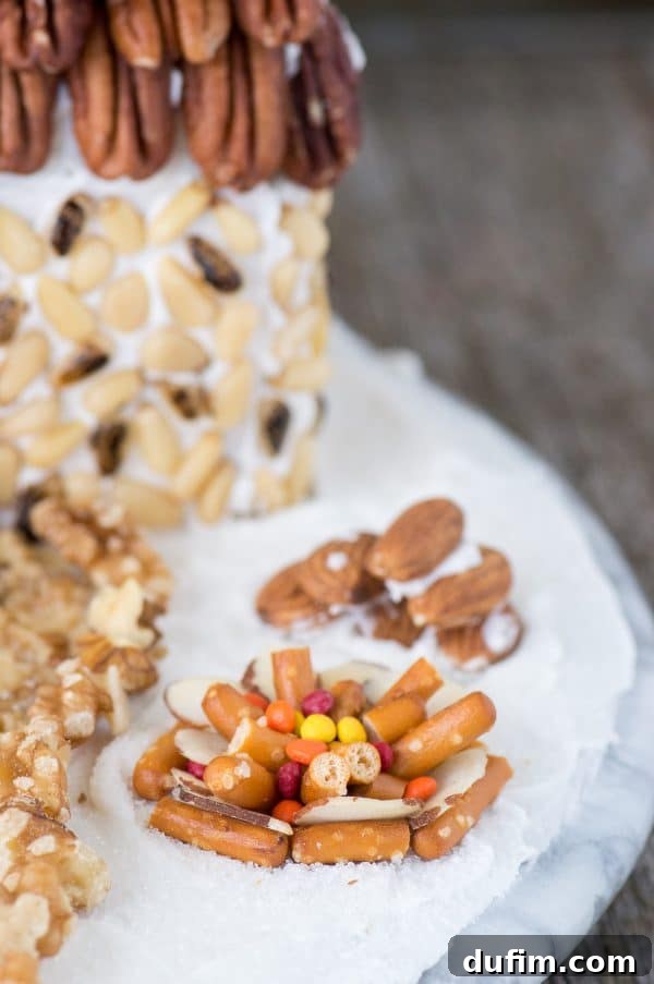 Festive Gingerbread Folly 13 Rustic gingerbread house adorned with a variety of nuts, creating a cozy holiday display.