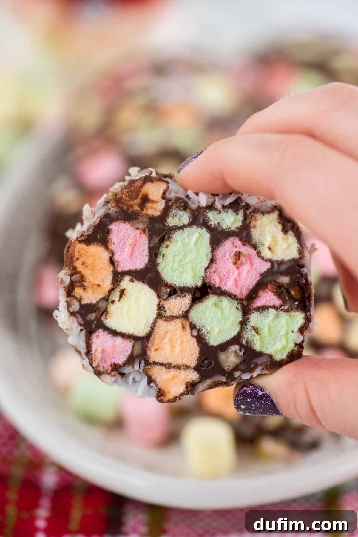 close up of no bake christmas church window cookie in a hand
