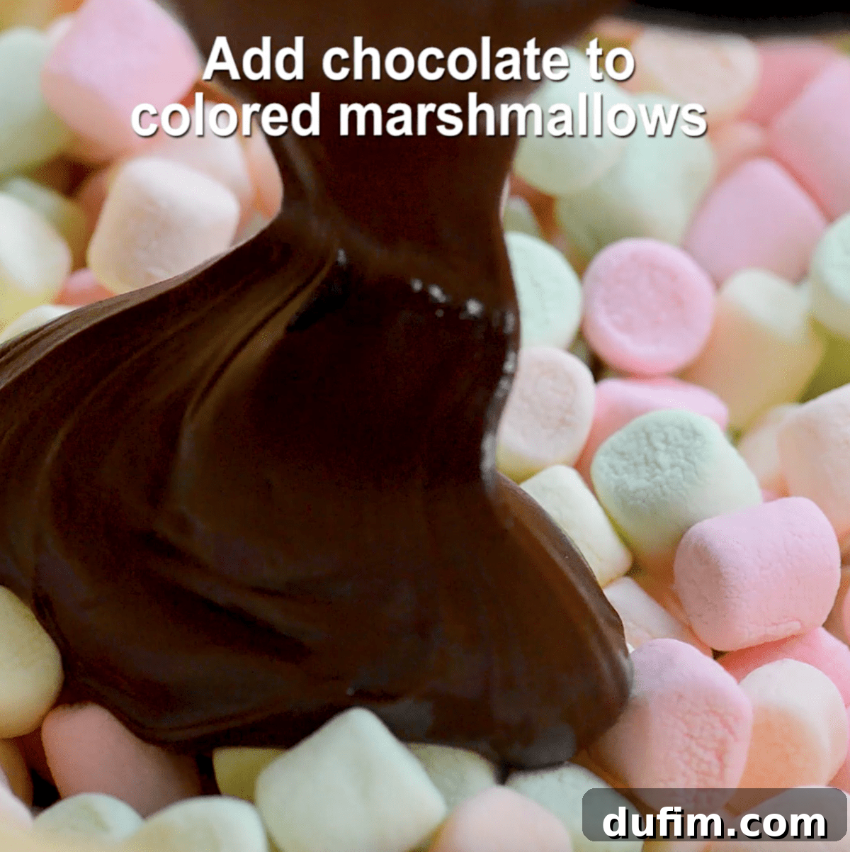 melted chocolate being mixed with colored marshmallows