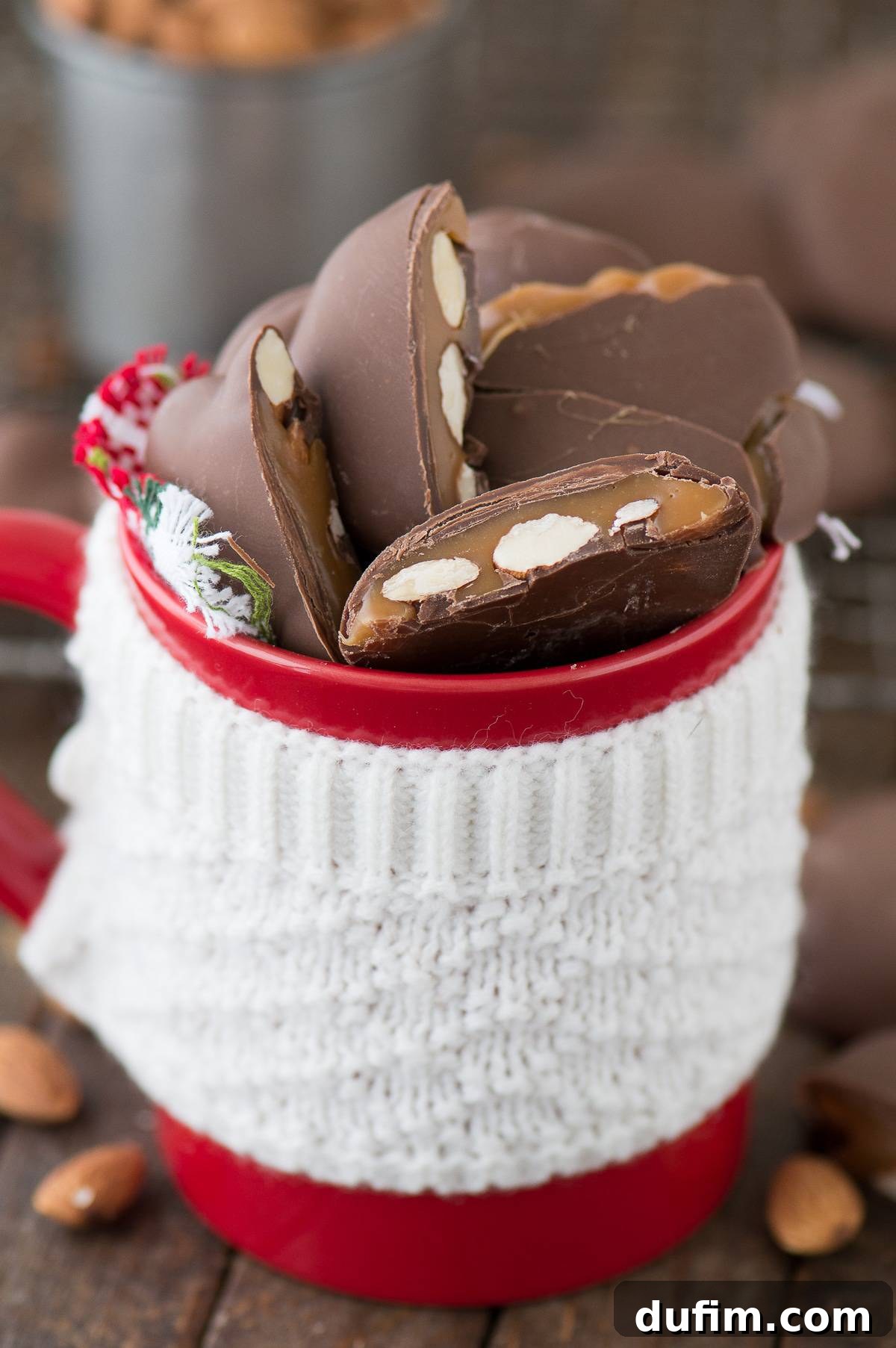 Williams Sonoma's Iconic Sticky Paws, Perfected at Home 2 Homemade Sticky Paws in a beautiful red mug on a wooden table, showcasing their festive appeal and delicious appearance.