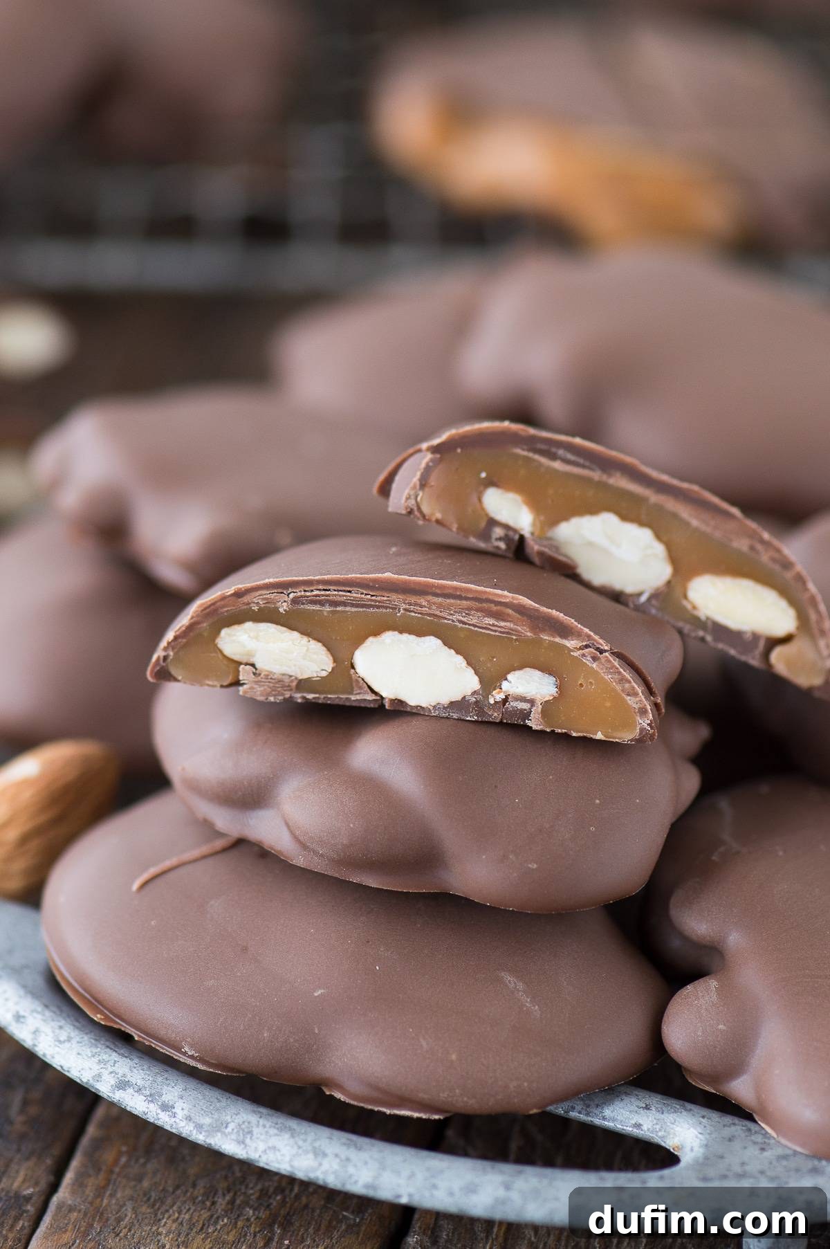 Sticky Paws Williams Sonoma Copycat Christmas candy recipe! Almond caramel clusters dipped in chocolate. Make these at home for a fraction of the price! Cooling rack full of this delicious Sticky Paws Williams Sonoma Copycat recipe, showing a large batch ready for storage or serving.