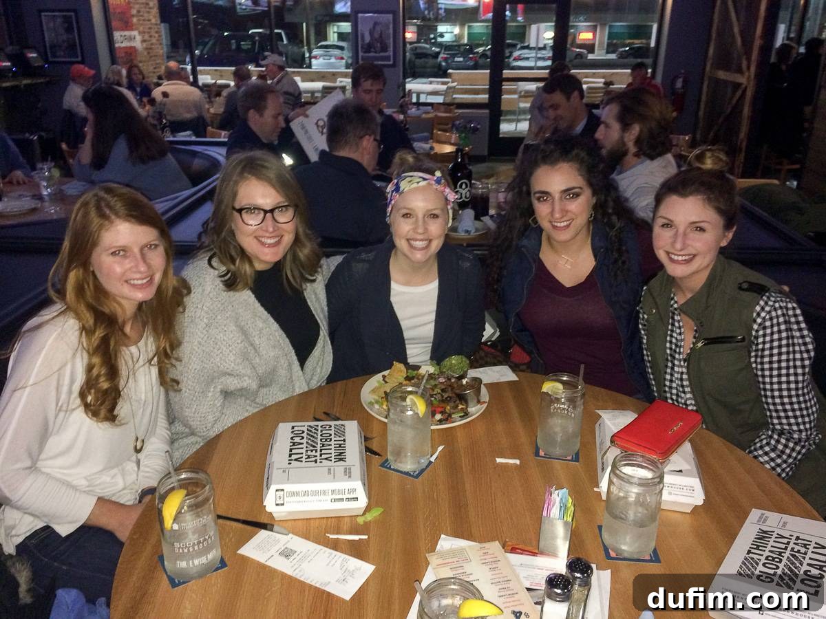 February 2017: Off the Menu 4 A group of smiling women gathered around a table enjoying a bible study dinner, celebrating a friend's new journey.