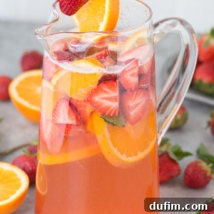 Fruity and refreshing homemade strawberry sangria! Gather up the juiciest strawberries, white wine, and a few other ingredients because you’ll want to make this recipe whenever warm weather hits!