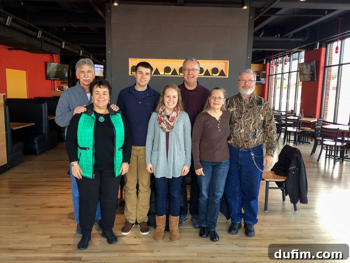 Ryan and his family, along with the blogger's family, gathered together to celebrate his PhD defense, sharing smiles and joy.