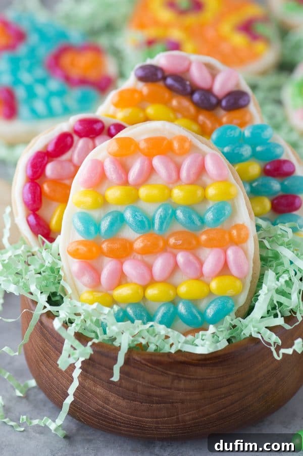 A selection of decorated Easter egg cookies featuring various patterns made from Jelly Belly jelly beans, showcasing creative possibilities and holiday cheer.