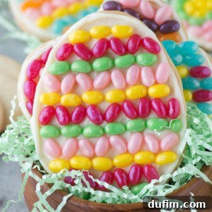 A finished Jelly Belly Easter Egg Cookie, showcasing vibrant jelly bean decorations on a frosted sugar cookie, ready to be enjoyed.