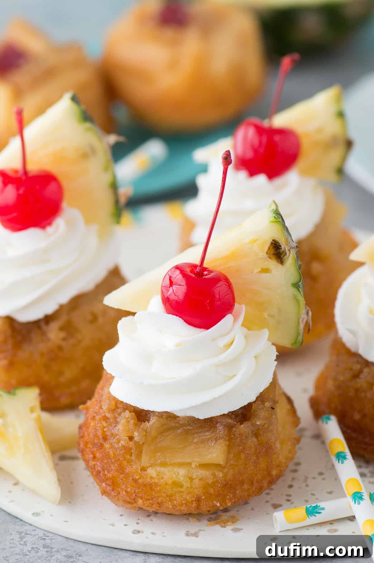 The BEST 7 ingredient mini pineapple upside down cakes! The cakes are so moist and I LOVE the presentation with the garnishes!