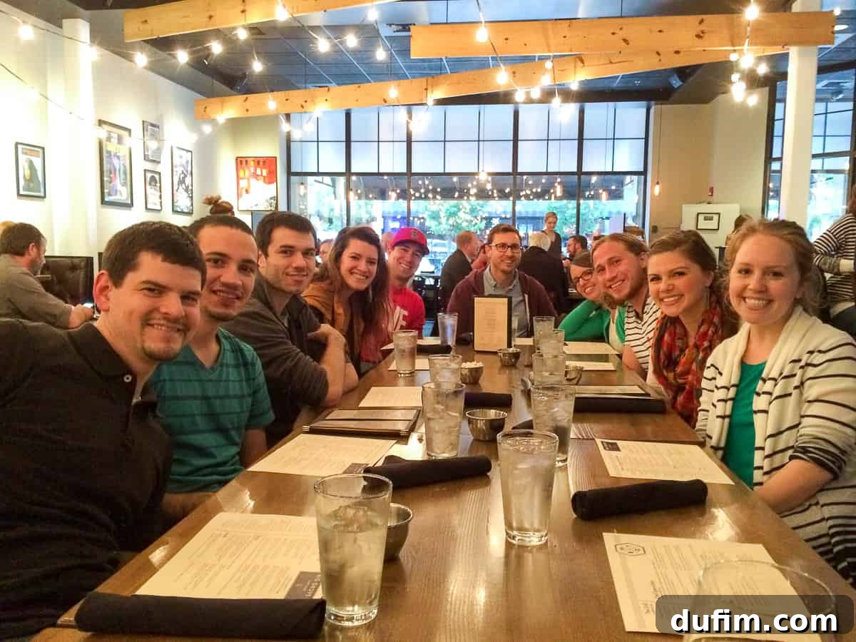 A small group of friends gathered for a final dinner, sharing laughter and camaraderie, representing a cherished church small group saying goodbye before a significant relocation.